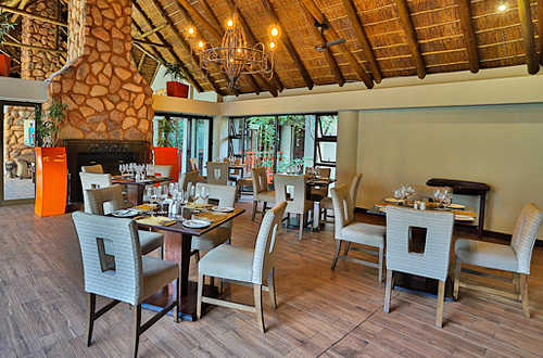 Dining room with fire place at Ivory Tree Game Lodge, Luxury Safari Accommodation in the Big Five Pilanesberg Game Reserve Pilanesberg Ivory Tree Game Lodge Big 5 Malaria Free Pilanesberg National Park South Africa